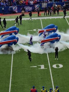 the jets are doing stunts on the football field