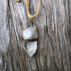 Large natural raw Himalayan crystal quartz point wrapped on  brass pendant on a tan leather lace  Pendant approximate dimensions; L 3"  X W 1.25"  Leather lace is about 36 inches long Bohemian Crystal Necklace With Large Stone, Bohemian Crystal Necklace With Large Adjustable Stone, Brass Pendant, Quartz Points, Crystal Quartz, Leather Lace, Himalayan, Leather And Lace, Tan Leather