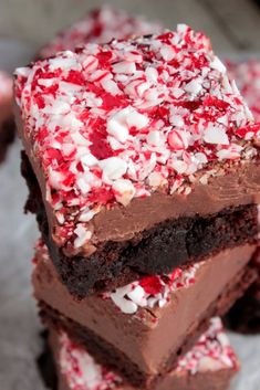 three pieces of peppermint brownies stacked on top of each other