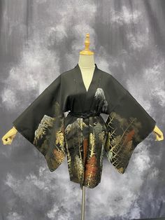 A gorgeous black Haori with a scenic mountain and forest design. This haori is in excellent condition. It is perfect to wear around the house or dress it up a bit and wear it outside over your jeans or as a dress. It can be worn as is, with a Japanese obijime/belt(shown in the 1st photo above ), or with our signature handmade kimono belt(sold separately). A dust cover and instructional care card will be included with your purchase. Belt: Our signature handmade silk belts are all made from kimono fabric and obijime(Japanese rope). Each is unique as they all have different obijime (Japanese belt/rope) and can be custom-made if desired. Each one is reversible and can be tied in various ways when worn. 1. Please check out the link below for details on our signature belts/sashes https://rinneki Feather Kimono, Black Haori, Handmade Kimono, Kimono Costume, Mountain And Forest, Kimono Belt, Kimono Style Jacket, Mode Kimono, Kimono Fabric