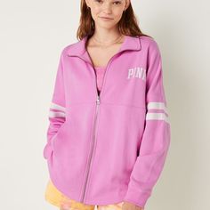 Victoria's Secret Pink Oversized Fleece Zip Up Sweater Pink Bloom Medium New Condition: New In Package Size: Medium Color:Pink Bloom Oversized Fit Mockneck Collar Neckline Full Zip Metal Zipper Closure Side Entry Pockets Rib Cuffs Top Applied Stripe Detail 28.5" Body Length Imported Oversized Long Sleeve Track Jacket For College, Varsity Style Spring Loungewear Tops, Relaxed Fit Long Sleeve Track Jacket For Loungewear, Oversized Varsity Sweatshirt For Spring, Spring Oversized Varsity Sweatshirt, Oversized Varsity Fleece Tops, Oversized Pink Outerwear With Ribbed Cuffs, Spring Fleece Outerwear, Casual Fleece Track Jacket For Spring