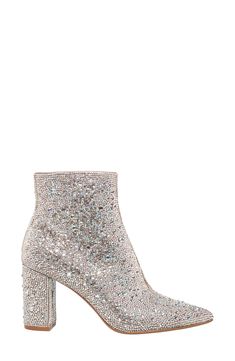 Instantly elevate any outfit with these fabulous pointy toe booties covered in a symphony of glittering crystals. 3 1/5" heel 5 1/5" shaft height Side zip closure Rhinestone and textile upper/textile lining/synthetic sole Imported Embellished Heels, Steal The Spotlight, Statement Accessories, Betsey Johnson, Heeled Mules, Bootie, Evening Dress, Mule Shoe, Side Zip