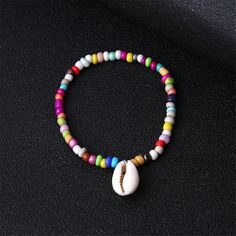 Channel sunshine with every step when you rock this beach-inspired anklet featuring colorful beads and shell charms. 7.87'' L Stretch Howlite / shell Casual Beaded Shell Bracelets, Casual Beaded Shell Bracelet, Casual Shell Beaded Bracelet, Casual Strand Shell For Beach Season, Beaded Shell Anklets For Beach, Casual Shell For Beach Season, Beachy Shell Beaded Bracelets For Summer, Casual Anklets With Round Beads For Vacation, Beaded Beachy Anklets For Beach Season