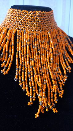 Dainty Choker | Orange Necklace | Multistrand Necklace | Custom Choker | Gift Ideas | Wholesale Necklaces | Customized Necklaces This statement necklace is made from beads. Main Color - Orange. Feel free to send me a convo or e-mail for any clarification or more information. Thank you for visiting, Traditional Orange Beaded Chain, Adjustable Bohemian Choker With Polished Beads, Bohemian Bib Necklace With Polished Beads, Traditional Orange Necklaces With Dangling Beads, Festival Bib Necklace With Large Round Beads, Traditional Orange Necklace With Dangling Beads, Bohemian Bib Necklaces With Polished Beads For Festival, Bohemian Festival Bib Necklaces With Polished Beads, Bohemian Silver Beaded Choker Necklace