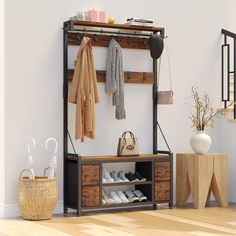 an entryway with shoes, coat rack and baskets on the floor next to it