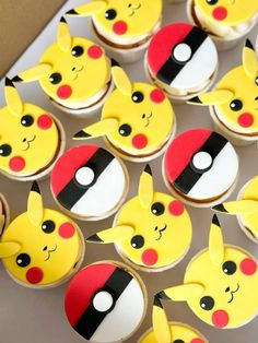 pokemon cupcakes with pikachu faces and ears are on a table next to each other