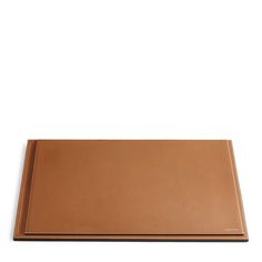 a brown cutting board on a white background