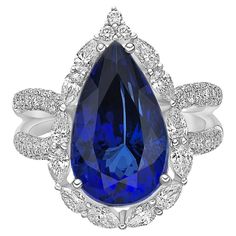 This collection features a selection of the most tantalizing Tanzanites. Uniquely designed in an art deco style with pear and rounds diamonds. The rich purple-blue hues of this gemstone with diamonds set in white gold to present a rich and regal look. Art Deco Style Tanzanite Ring with Diamond in 18 Karat White Gold. Tanzanite: 8.732 carat, 16.20X9.80mm size, Pear Shape. Diamond: 0.763 carat, 3.50X2.00mm size, pear shape, G color, VS clarity. Diamond: 0.046 carat, 1.50mm size, round shape, G col Luxury Pear-shaped Sapphire Jewelry, Gia Certified Luxury Pear-shaped Jewelry, Teardrop Gemstone Ring For Formal Occasions, Luxury Sapphire Halo Ring For Formal Occasions, Gia Certified Teardrop Diamond Ring For Formal Occasions, Formal Tanzanite Teardrop Jewelry, Formal Gia Certified Teardrop Diamond Ring, Luxury Tanzanite Pear-shaped Jewelry, Luxury White Gold Pear-shaped Sapphire Ring