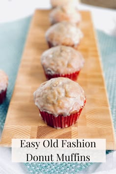 some muffins are sitting on a cutting board with the words easy old fashion donut muffins