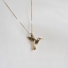 "Humming Bird Pendent Necklace . . . * Pendants Measurements With Bail: (16 x18 mm) * Gold KT: 14K Gold * Gold Color: Yellow Gold * Chain: Optional * Chain: 1 Box Chain * Stamp: 14k * Never gold filled or plated * 1-Day Shipping * Packaged With Free Gift Box . . . If you have any questions, just hit the \"Message the Seller\" button ( bottom right of the page) and we will get back to you within a few hours. . . . Check our Social Media @Talajewel, and let's be friends!  . . . Made in USA, Humming Bird Pendent Necklace, 14k Solid Yellow Gold Dainty Bird Necklace, Tiny Bird Necklace, Solid 14k Gold Charm, Gold Bird Necklace, Gift for babies, 14K Bird Charm Pendant, 14k solid gold Bird necklace, yellow gold necklace, thin chain, Dainty good luck necklace, Great for Layers. A Perfect 14K Gold Humming Bird Necklace, Gold Bird Necklace, Hummingbird Aesthetic, Pendents Gold, Hummingbird Jewelry, Scorpio Necklace, Dainty Pendant Necklace, Astrology Jewelry, Hummingbird Necklace