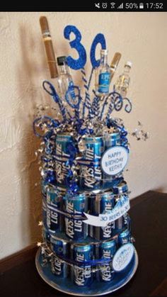 a birthday cake made out of cans and decorations