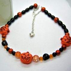 Acrylic Pumpkin Center Beads, With Crackle Glass And Black Solid Glass Pearl Beads And Howlite Black Skulls! Approximately 22 Inches, Made With Sterling Silver Chain And Clasp. Handcrafted! One Of A Kind. Halloween Necklace, Crackle Glass, Black Skulls, Black Halloween, Hand Crafted Jewelry, Pumpkin Orange, Crafted Jewelry, Black Solid, Black Orange