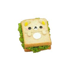 a sandwich that has been made to look like a bear with eyes and ears on it