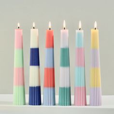 multicolored candles lined up next to each other