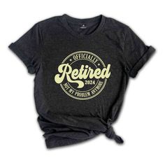 a women's black shirt with the words retired printed on it and an image of a