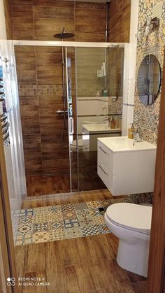 a bathroom with wooden floors and tile walls