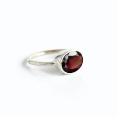 Click ⬆PERSONALIZE IT to see how your ring will look! You'll fall in love with the deep red coloring of this Garnet Quartz ring. This is a perfectly sized oval to compliment any collection. Popular as a birthday gift for those January babes and Garnet lovers alike. This is a dark, transparent red gemstone with no flaws. This stone is beautifully faceted and bezel set in a 925 sterling silver band or plated with 18k vermeil gold. Red Oval Stackable Promise Rings, Oval Garnet Rings As Gift, Oval Garnet Ring For Gift, Minimalist Red Oval Rings, Red Gemstones, Garnet Ring, Oval Rings, January Birthstone, Garnet Rings