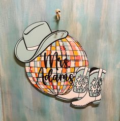 an image of a cowboy hat and boots with the words mr & mrs painted on it