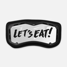 a black and white sign that says let's eat