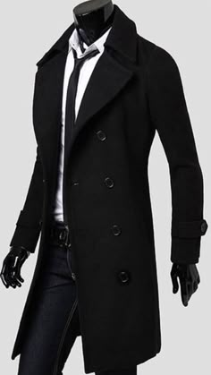 a mannequin dressed in a black coat and tie