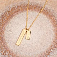 Show off your special memories and milestones with this beautiful Coordinate Date Bar Necklace. Handcrafted in golden tones, this sophisticated piece of jewelry is the perfect way to keep your treasured memories close to your heart. Surprise your loved one with this meaningful and lasting gift. Available in 14k gold plated, rhodium plated or 14k rose gold plated brass Large Bar: 1/4" by 1 1/4"; Small Bar: 1/4" by 3/4" 16" cable chain with 2" extender Lobster claw closure With engraving this item Date Bar, Date Bars, Large Bar, Small Bar, Silver Bar Necklace, Trendy Necklace, Gold Bar Necklace, Hot Jewelry, Trendy Necklaces