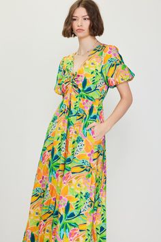 A color palette of mood-boosting brights enlivens this floral-printed midi dress. Framed by voluminous bubble sleeves, it's got a V-shaped neckline with tie detailing that lets you adjust the fit of the bodice. •V-shaped neckline •Adjustable tie detailing •Short bubble sleeves •Elasticized back waist •Mid-length hem Item Number: 99794 Vacation Dresses Casual, Wedding Guest Dress Trends, Casual Wedding Dress, Floral Print Midi Dress, Print Midi Dress, Vacation Dresses, Sweater Sale, Printed Midi Dress, Trending Dresses