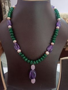 AAA Emerald Beryl Dyed, Fresh Water Pearl Faceted Rondelle 8 mm Beads With Center Tumble Gemstone 20 inch Necklace Stone : Emerald Beryl dyed, Fresh Water Pearl, Amethyst Shape :- Rondelle Size :- 6-8mm 1. Weight :- 246 carat With Amethyst Tumble, 20 INCH Necklace Polish :- Handmade Purity :- AAA color - green, blue It is known as the 'love stone' as the message it emits is the strong vibration of unconditional love, joy, warmth and healing. As quartz crystals are profound amplifiers of energy, Natural Stone Necklaces Handmade, Green Necklaces, Pearl Amethyst, Amethyst Tumbled, 20 Inch Necklace, Stone Necklaces, Carnelian Bracelet, Beaded Necklace Designs, Necklaces Handmade