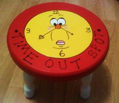 a child's stool with the words time out on it and an image of a cartoon character