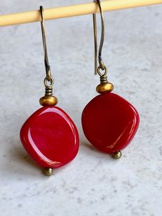 "deep red czech glass earrings boho dangle earrings for women These round-ish, opaque deep red discs are Czech glass beads. Sitting on top is a small, matte gold glass disc. Hook ear wires are antiqued brass. Length of earrings from top of ear wires is 1 1/2\". Red discs measure about 15mm, just over 1/2\". You can enter my shop here: gypsydangles.etsy.com" Beaded Wrap Bracelets, Leverback Earrings, Wrap Bracelets, Bohemian Earrings, Purple Glass, Exeter, Gold Glass, Brass Earrings, Earrings Boho