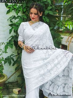 The Chikan Label White Georgette Jaal Saree Lucknawi Chikankari SariPRODUCT  DETAILSThe Chikan label Designer studio presents White Georgette Jaal Saree Lucknawi Chikankari Sari. This collection one of the most closest to our heart. Each saree takes more than 1.5 month to complete. And the only tools our women artisan uses are needles & her hands. She pours all her love and dedication into it as if nurturing a newborn child. Abundance of hardwork and creativity goes into making these delicat Festive Embroidered White Lace, Traditional White Lace With Intricate Embroidery, Traditional White Embroidered Lace Fabric, White Lace Saree With Lace Work, Unstitched White Blouse Piece With Chikankari Embroidery, Unstitched White Chikankari Embroidery Blouse Piece, White Anarkali Blouse With Chikankari Embroidery, White Chikankari Embroidery Blouse Piece Unstitched, Eid Lace Blouse With Chikankari Embroidery