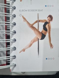 a spiral bound notebook with an image of a woman doing pole dancing