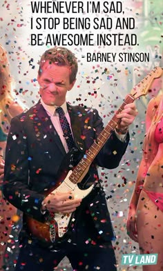 two women in bikinis and a man with a guitar are surrounded by confetti