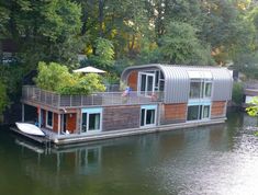 a house boat is floating on the water