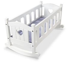 a white wooden crib with blue sheets on the bottom and heart cutouts at the top