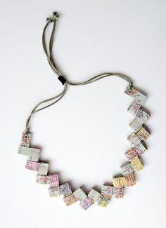 a necklace made out of old bank notes