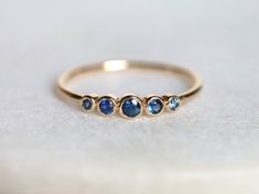 Blue sapphire ring, Blue sapphire stacking ring, dainty ring, stacking ring, stackable ring, blue sapphire ring, Sapphire ring Available in 9k/14k/18k yellow, rose or white gold. Same design can be made also with other custom gemstones per request. Product details: - Solid gold - approx 2.5, 2, 1.5 mm sapphire round - Band size is 1.2mm Ring size - US 3 to US 9 (for smaller or larger ring size, please contact) Please select your size at the drop down menu. Service Available - Customization Avail Blue Sapphire Stackable Rings For Promise, Adjustable Blue Sapphire Ring Fine Jewelry, Blue Stackable Rings Fine Jewelry, Blue Sapphire Ring With Bezel Setting For Promise, Blue Stackable Promise Rings, Handmade Blue Promise Ring, Blue Fine Jewelry Stackable Rings With Bezel Setting, Blue Bezel-set Ring Jewelry, Blue Bezel Set Stackable Rings Fine Jewelry