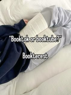 a person laying on top of a bed with a book in their lap and the caption reads, bookstk or booktub?