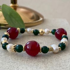 "Christmas Bracelets This design bracelets are made of green agate, pearls and red agate stones. When people think of the colors red and green, one thing comes to mind: Christmas. Red has long been a powerful color associated with fire, spiritual awakening, and the blood of Jesus Christ, whose birthday is celebrated on December 25. Green often symbolizes money, good luck, and health through the holidays and into the new year. ☆ Each of the pearls we use to create bracelets were formed by nature Cheap Elegant Christmas Bracelets, Natural Stones Pearl Bracelet As A Gift, Red Natural Stones Bracelets For Gift, Jade Pearl Bracelet With Natural Stones Gift, Colorful Agate Beads Bracelets As Gift, Red Crystal Bracelet With Natural Stones For Gift, Red Natural Stones Crystal Bracelet Gift, Elegant Agate Beaded Bracelets For Gift, Green Agate Bracelets For Gifts