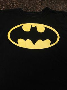 DC Comics Batman black T-shirt, kid size XXL (18) black. Short sleeve, no stains,  rips or tares.  Condition is Pre-owned. Shipped with USPS First Class Package. Black Graphic Print Top For Fan Conventions, Black Tops With Screen Print For Fan Conventions, Black Screen Print Tops For Fan Conventions, Black Pre-shrunk Shirt For Fan Conventions, Pop Culture Black T-shirt For Fan Merchandise, Black Letter Print T-shirt For Fan Conventions, Black Graphic Tee For Fan Conventions, Black Pop Culture T-shirt For Fan Merchandise, Black Band Merch Tops For Fan Conventions