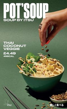 a poster for a soup by itsu restaurant with a hand sprinkling some food into the bowl