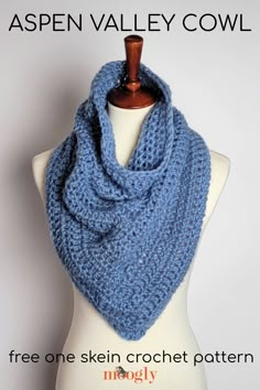 a blue knitted scarf on top of a mannequin