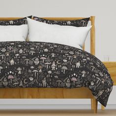 a bed with black and white designs on it