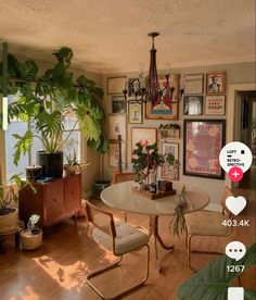 a living room filled with furniture and lots of plants