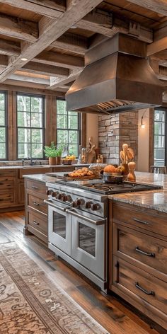 a large kitchen with an oven, stove and counter top in the middle of it