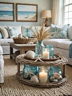 a living room filled with lots of furniture and candles on top of a coffee table