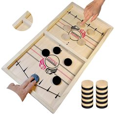 an image of a game set with two pieces and one hand pointing at the board