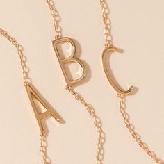 Layered looks are trending, and the luxurious Precious Elongated Initial Necklace is the perfect personal touch to your neck stack. This letter necklace is brilliantly crafted with a 14K gold-plated sterling silver chain and an elongated initial letter uniquely strung sideways. Whether you choose to wear your own initial or that of a cherished loved one, this necklace is a timeless piece that keeps your most treasured connections beautifully close to your heart. Neck Stack, Jewelry Style Guide, Glam Gifts, Bar Jewelry, Bow Shop, Halloween Charms, Holiday Sparkle, Because I Love You, Disney Jewelry