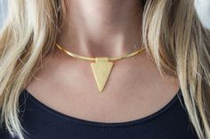 Gold Arrowhead choker Necklace. Geometric Triangle Necklace Statement Necklace Gift for her Everyday Birthday Christmas gift  Looking for a beautiful gift? You will love this beautiful Gold Arrowhead choker necklace.  Details: - 16K Gold plated Necklace  - Size: 17 inches long or 43 cm - Pendant: 1.02x1.77 inches or 26x45 mm - It will come in a beautiful pouch ready to offer You may also like Opal Gold Pendant necklace https://www.etsy.com/listing/682023404/opal-pendant-gold-coin-necklace?ref=shop_home_active_2 Gold & Leather Personalized ID Bracelet  https://www.etsy.com/ca/listing/399630285/personalized-gold-bracelet-personalized Gold, Silver & Rose Gold Personalised Name bracelets https://www.etsy.com/ca/listing/242867792/personalized-gold-bracelet-custom-name Gold Personalized Monogram Minimalist Handmade Party Necklaces, Chic Handmade Necklace For Gifts, Chic Handmade Choker As Gift, Chic Handmade Choker For Gift, Modern Metal Choker As A Gift, Modern Metal Choker As Gift, Modern Party Choker Necklace, Gold Triangle Jewelry For Anniversary, Minimalist Handmade Choker As A Gift