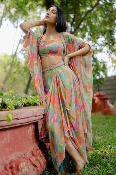 New Trending Tops For Women, Dhoti Skirt With Crop Top And Jacket, Crop Top With Skirt And Jacket, Dhoti With Jacket Women, Plazo Skirt Design, Draped Skirt Outfit Ideas, Pastel Colour Traditional Outfit, Floral Mehendi Outfits For Bride, Designer Indian Outfits Woman