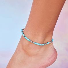 Brighten up your summer wardrobe with our Turquoise Bead Stretch Anklet! A vibrant way to liven up any look, this easy slip-on style anklet is the perfect beach accessory. Cheap Blue Anklets With Colorful Beads, Blue Beaded Bracelets For Summer Festival, Blue Anklets For Beach Season, Trendy Summer Anklets With Round Beads, Blue Bohemian Ankle Wrap Anklet, Turquoise Beaded Bracelets For Beach Season, Turquoise Anklets With Tiny Beads For Festival, Beach Anklet With Tiny Beads On A Strand, Turquoise Beaded Anklets For Beach Season